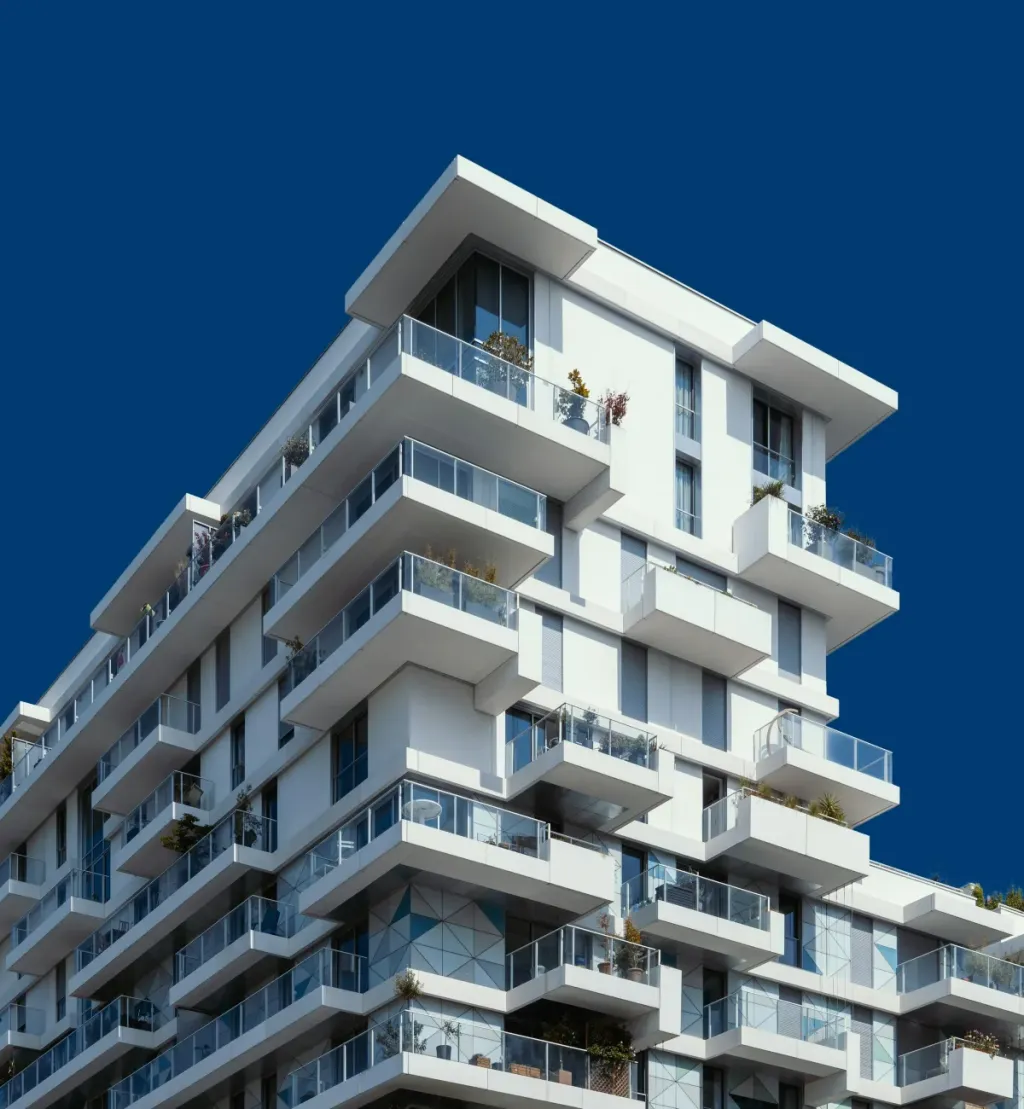 Modern apartment building with balconies against a blue sky